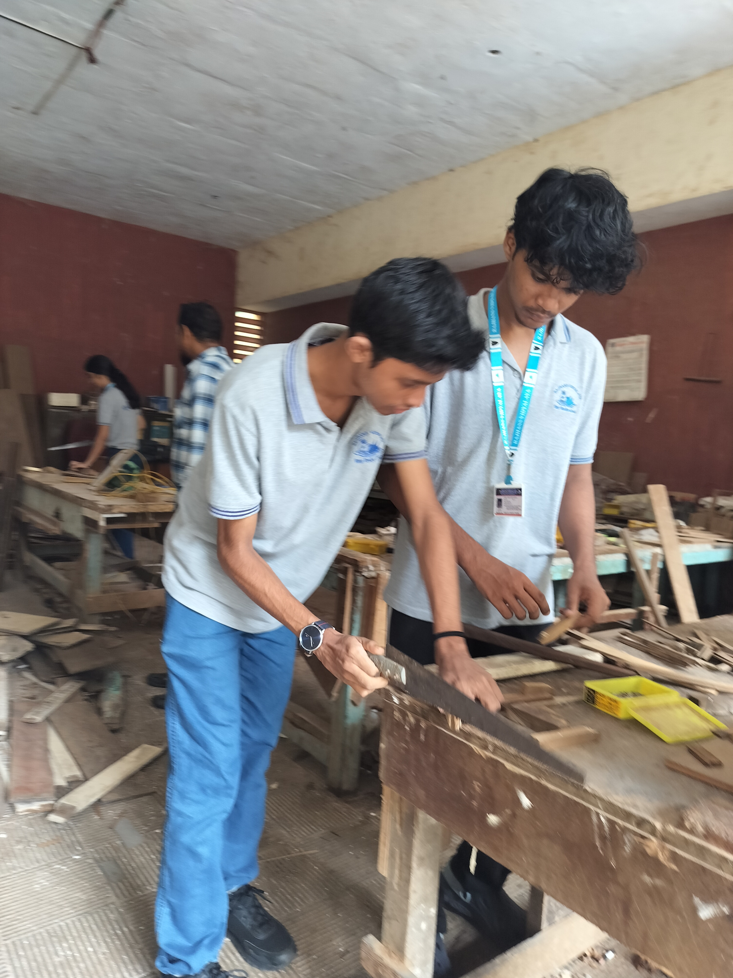 Std. XI students visited the school carpentry lab for a Engineering Graphics activity based on orthographic projection of machine blocks.
