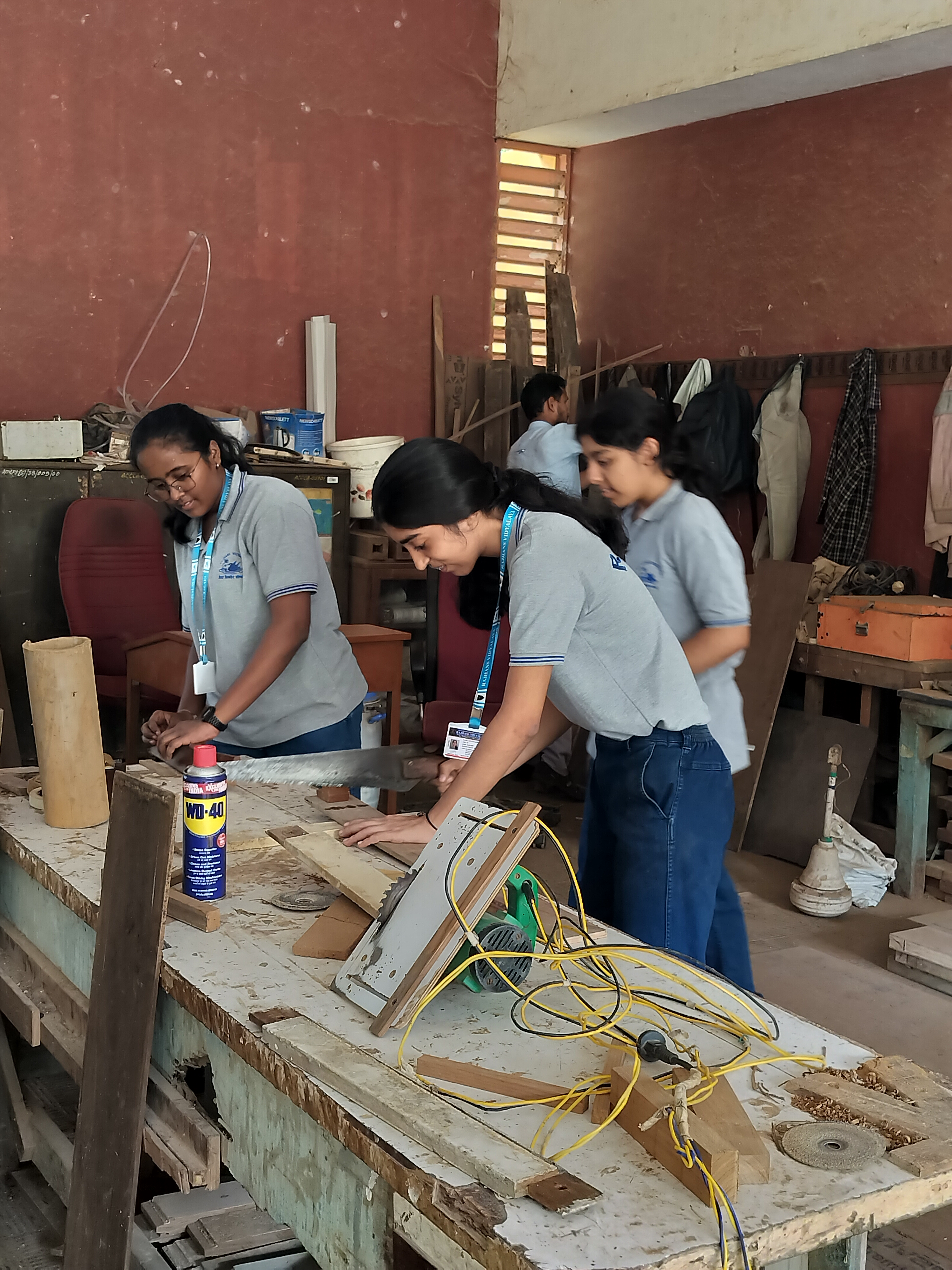 Std. XI students visited the school carpentry lab for a Engineering Graphics activity based on orthographic projection of machine blocks.