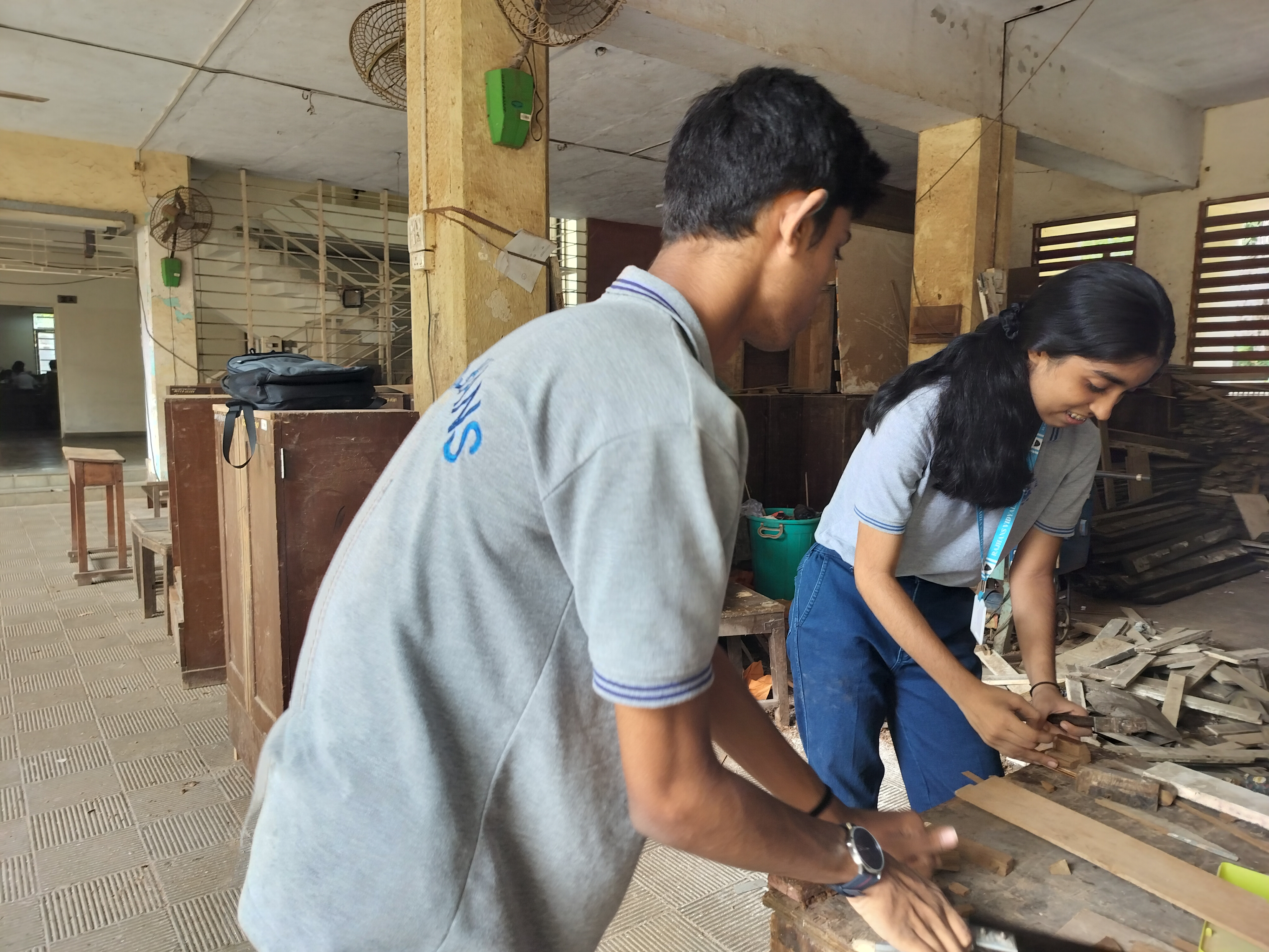 Std. XI students visited the school carpentry lab for a Engineering Graphics activity based on orthographic projection of machine blocks.