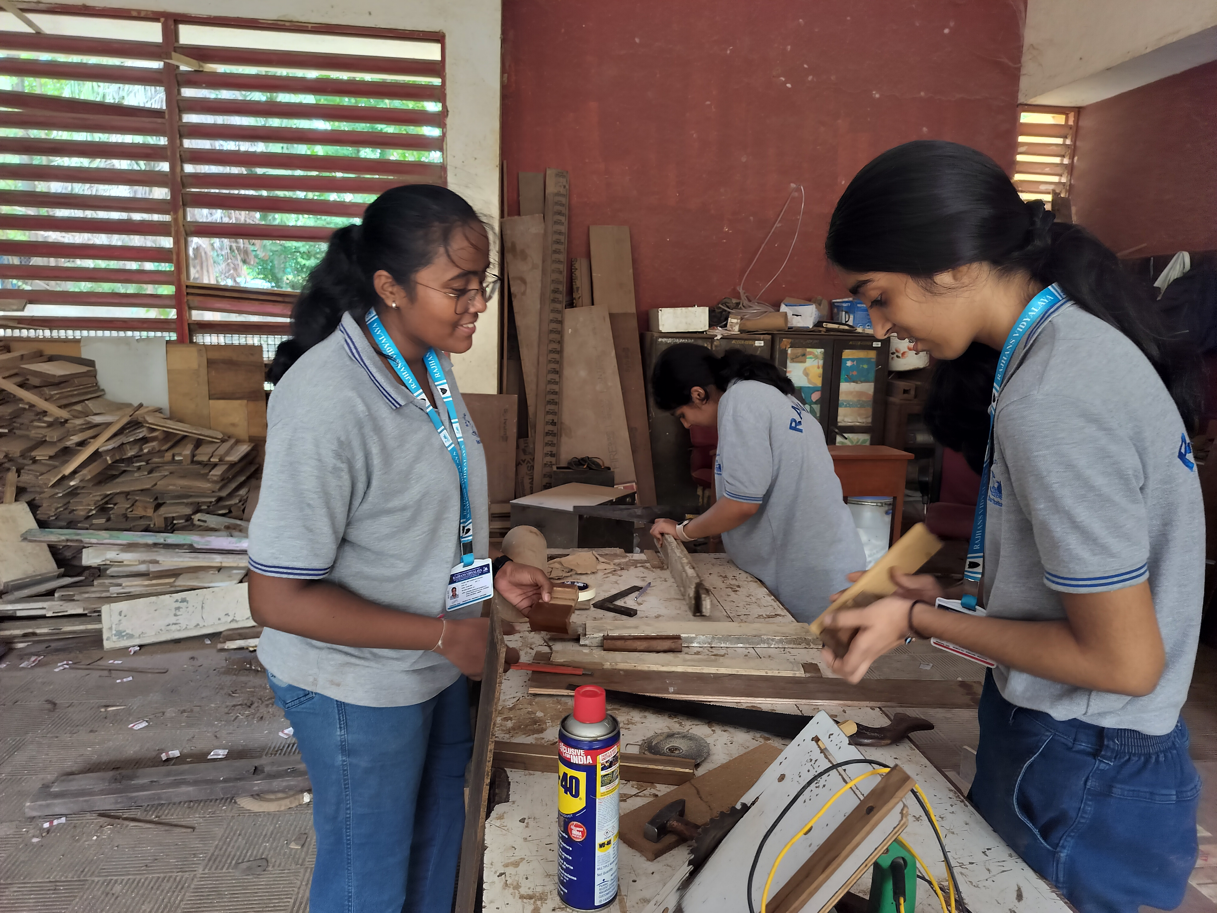 Std. XI students visited the school carpentry lab for a Engineering Graphics activity based on orthographic projection of machine blocks.